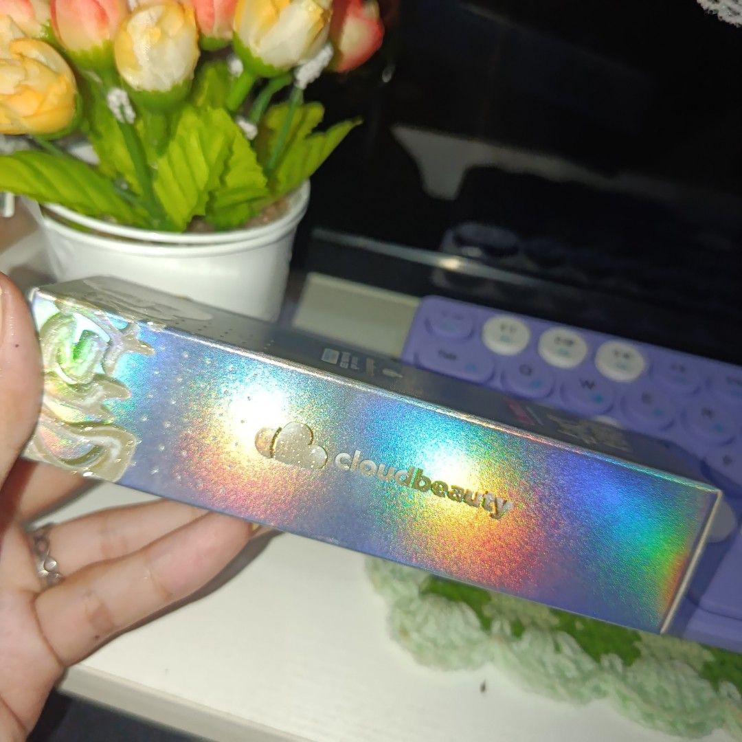 Cloud Beauty Glist Dust Highlighter - Cupid (Category: Makeup) located in Muntinlupa City. Submitted by cham_porado15 (Listing ID 1446171029, Image 3). Description: - Brand: Cloud Beauty - Product: Glist Dust Highlighter - Shade: Cupid - Finish: Shimmery powder with a subtle pinkish tone - Packaging: Beautiful holographic design - Effect: Provides a gentle, sparkling glow - Ideal for: Adding a touch of sparkle to makeup - Condition: Comes in its 