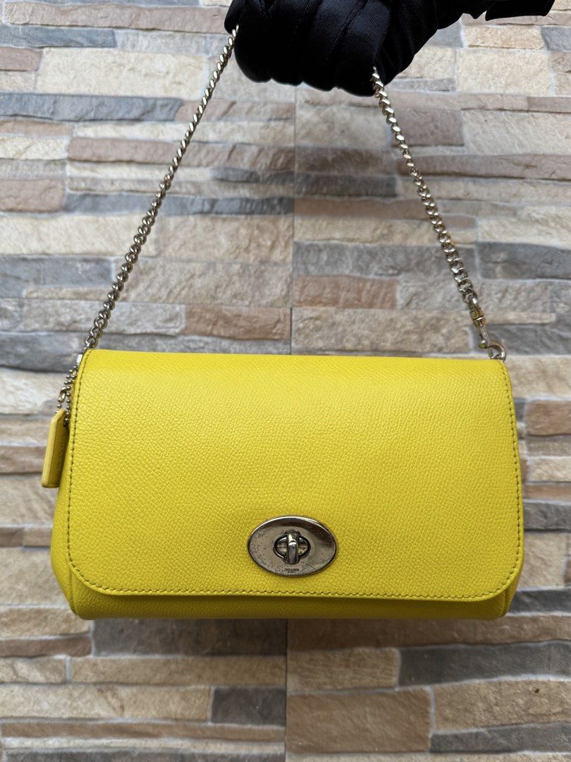 Coach Mini Ruby (Category: Luxury Bags & Wallets) located in Cavite. Submitted by justbrowsing_decluttering (Listing ID 1446221113, Image 1). Description: Cross-body | Shoulder Bag 1 pocket inside Color: Yellow/Mustard with Gold Tone Hardware Size: Small Material: Genuine Leather [Colors may vary due to lighting. Bags are Preowned so it will Not be Perfect; Unless stated new.] Stratches on Hardware Guaranteed Authentic💯 Condition: 7/10 Rank: B .