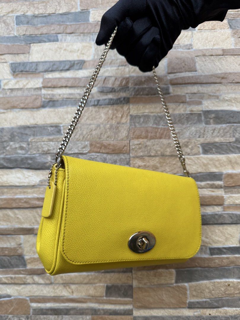 Coach Mini Ruby (Category: Luxury Bags & Wallets) located in Cavite. Submitted by justbrowsing_decluttering (Listing ID 1446221113, Image 2). Description: Cross-body | Shoulder Bag 1 pocket inside Color: Yellow/Mustard with Gold Tone Hardware Size: Small Material: Genuine Leather [Colors may vary due to lighting. Bags are Preowned so it will Not be Perfect; Unless stated new.] Stratches on Hardware Guaranteed Authentic💯 Condition: 7/10 Rank: B .