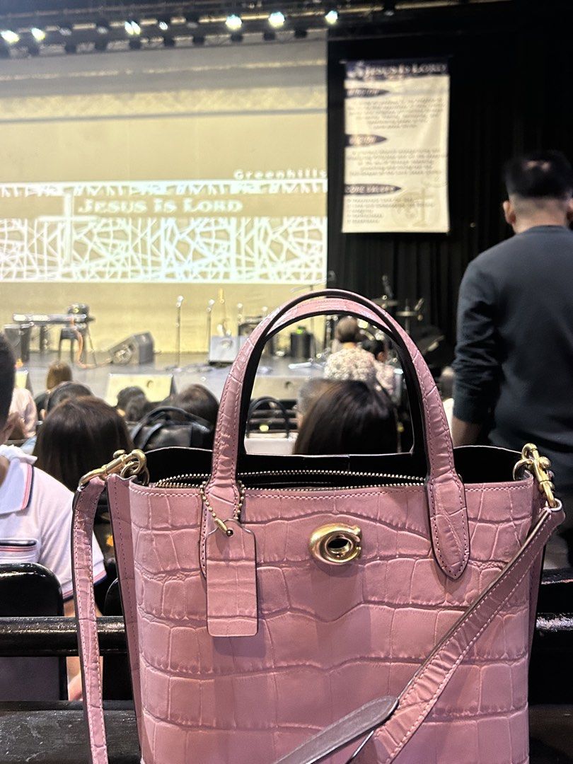 Coach Pink Croc Embossed Leather Tote Bag (Category: Shoulder Bags) located in Manila. Submitted by angelsnoow (Listing ID 1443351814, Image 3). Description: - Coach pink croc embossed leather tote bag - Features a secure turn-lock closure - Includes a detachable crossbody strap for versatile carrying - Comfortable top handles - Comes with original Coach hangtag - Ideal for both daily errands and special events.