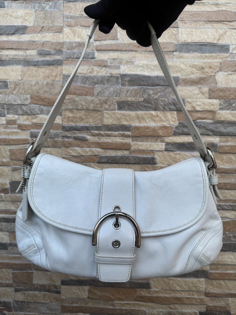 Coach Soho Leather Shoulder Bag (9248) (Category: Luxury Bags & Wallets) located in Cavite. Submitted by justbrowsing_decluttering (Listing ID 1446244737, Image 1). Description: Shoulder Bag 1 Full Back Pocket | 1 Zip Pocket inside Color: White with Silver Tone Hardware Size: Medium Material: Genuine Leather [Colors may vary due to lighting. Bags are Preowned so it will Not be Perfect; Unless stated new.] Signs of use sa leather Guaranteed Authen