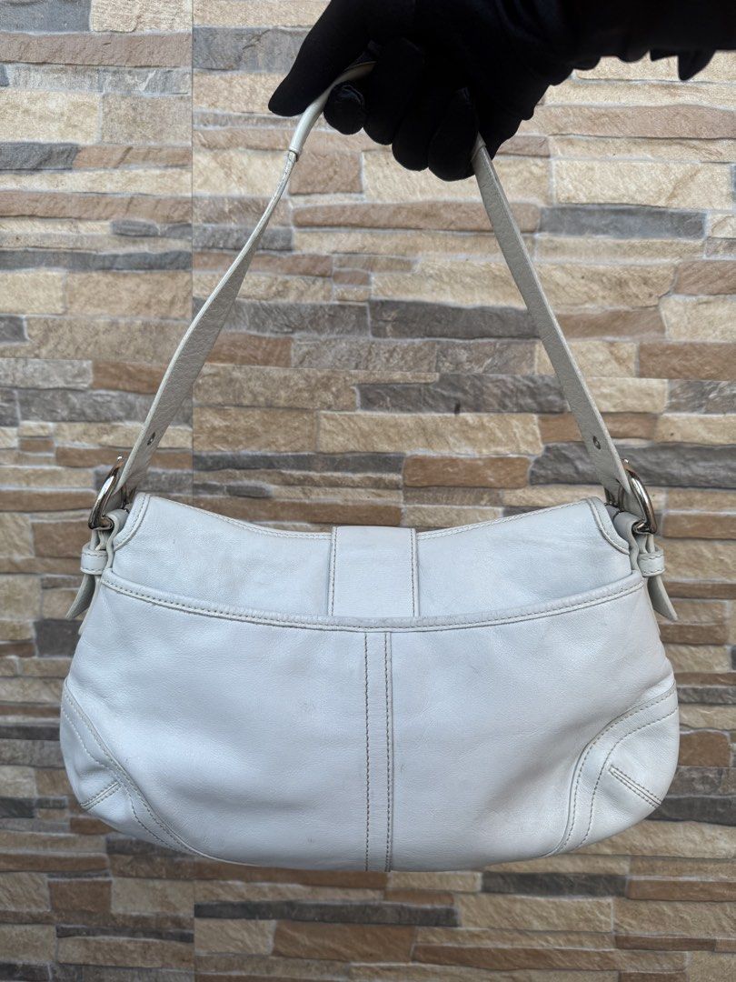 Coach Soho Leather Shoulder Bag (9248) (Category: Luxury Bags & Wallets) located in Cavite. Submitted by justbrowsing_decluttering (Listing ID 1446244737, Image 3). Description: Shoulder Bag 1 Full Back Pocket | 1 Zip Pocket inside Color: White with Silver Tone Hardware Size: Medium Material: Genuine Leather [Colors may vary due to lighting. Bags are Preowned so it will Not be Perfect; Unless stated new.] Signs of use sa leather Guaranteed Authen