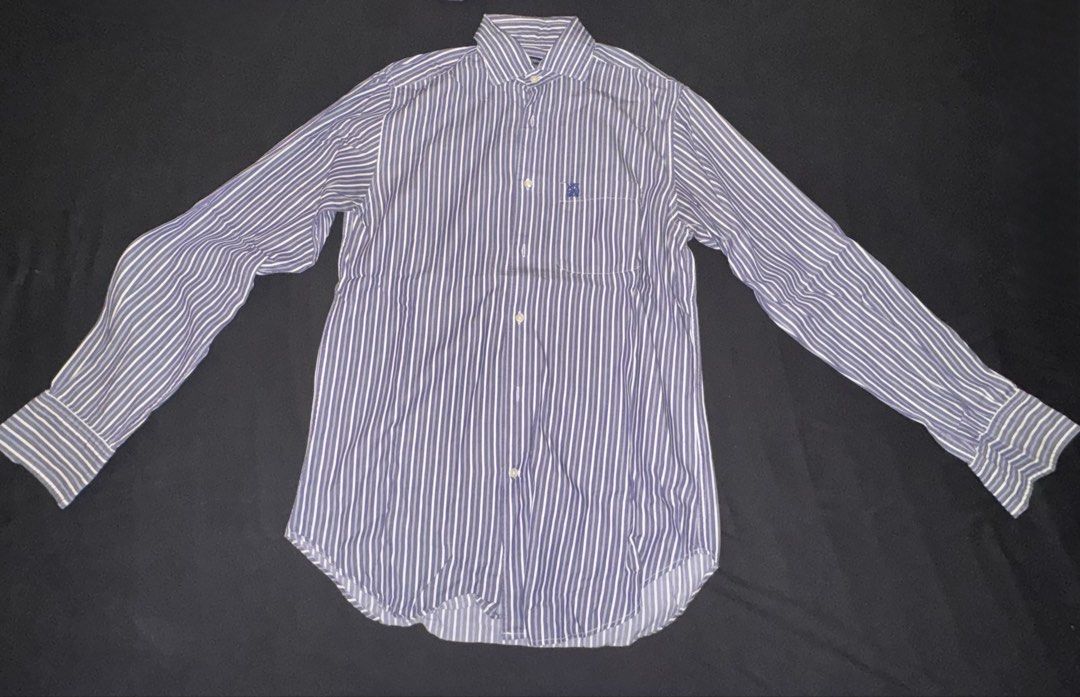 Cortefiel Tailored Fit Striped Button-Up Shirt (Category: Tshirts & Polo Shirts ) located in Taguig. Submitted by crossmill23 (Listing ID 1446331009, Image 1). Description: - Cortefiel tailored fit shirt - Classic blue and white vertical stripes - Long sleeves with button cuffs - Button-up front - Perfect for smart casual or work attire - Comfortable fabrics - RFS: Outgrown.