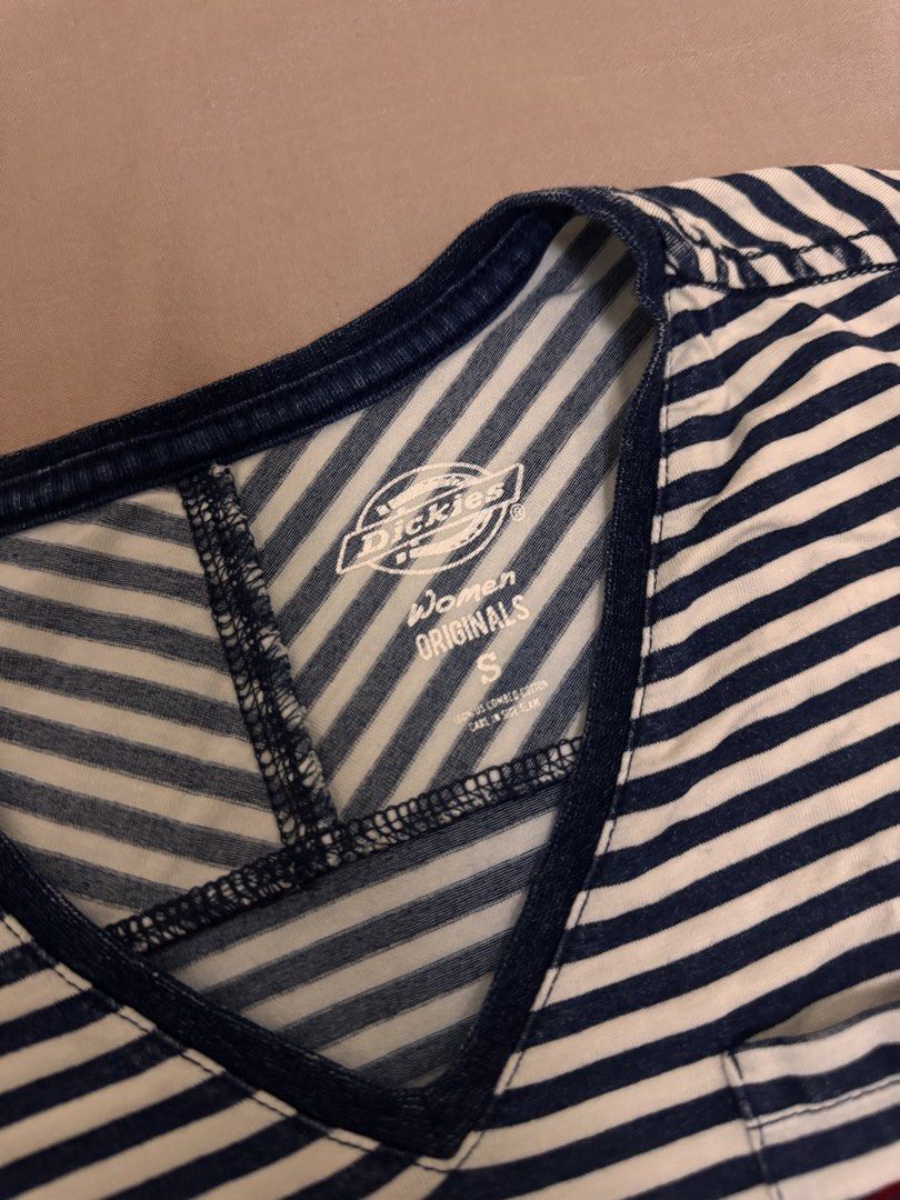 Dickies blue and white top with red logo (Category: Shirts) located in Manila. Submitted by rianbfr (Listing ID 1446296922, Image 3). Description: rarely used, still in good condition—no discoloration, stains, and tears. .