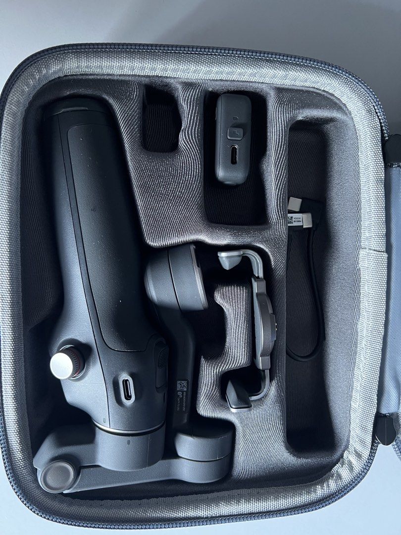 DJI Osmo Mobile Gimbal Stabilizer with Case (Category: Gimbals & Stabilizers ) located in Makati City. Submitted by martine0825 (Listing ID 1446253605, Image 3). Description: - DJI Osmo Mobile 3 Gimbal - Achieve incredibly smooth video shots with your smartphone - Includes original case and all accessories shown - Compact and highly portable for filming on the go - Simple setup and user-friendly operation - Get stable, professional-looking footag