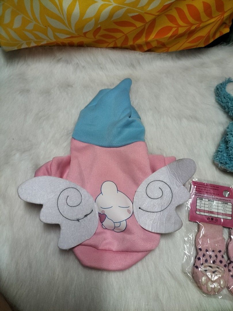 Dog Clothes, Bunny Hat, and Pet Socks Bundle (Category: Homes & Other Pet Accessories) located in Taytay. Submitted by tina.bel.s (Listing ID 1446188651, Image 2). Description: Pet Items for Sale Pink hoodie Bundle - 300php -Includes Pink hoodie(XS size), Rabbit head wear and 2 pc socks Chucky Costume for dogs- 180 php - Costume and wig Cute Pet Leash( brand new) - 90php each Pet leash adjustable color Red- 150 php Pet Carrier Cream and orange ch