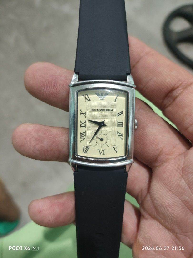 Emporio Armani Rectangular Watch (Category: Women's Watches) located in Subic. Submitted by regiegabriel29 (Listing ID 1446297601, Image 1). Description: - Emporio Armani Watch - Rectangular face with cream dial - Classic Roman numeral hour markers - Durable black rubber strap - Stainless steel case - Water resistant up to 50 meters (5 ATM) - Ideal for everyday wear - add sf 200 .