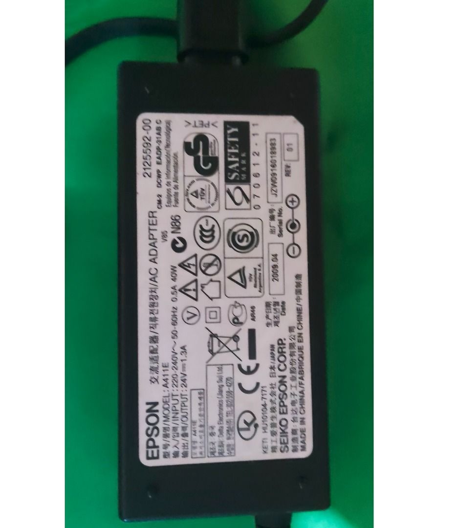 Epson AC Adapter Model A411E 24V 1.3A (Category: Printers, Scanners & Copiers) located in Binan City. Submitted by enrivo (Listing ID 1446325630, Image 1). Description: - Epson AC Adapter - Model: A411E (Rev: 01) - Input: 220-240V~50-60Hz 0.5A 40W - Output: 24V 1.3A (40W) - Primarily used for Epson Photo Scanners (such as the V500, V600, V700, and GT-1500) - Connector: 6.5 x 4mm center pin barrel - Condition: Works well, tested..