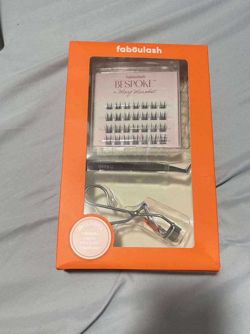 Faboulash Bespoke Edit False Eyelashes Kit (Category: Makeup) located in Silang. Submitted by declutterswuni (Listing ID 1446308510, Image 2). Description: - Includes 2 pairs of bespoke lashes (no lierge) - Comes with a pro curler and applicator. - Create voluminous, soft glam, or lifted looks. - Designed for a balanced, fluffy lash line. - Perfect for everyday wear or special occasions. - Easy to apply for a fluttery effect..