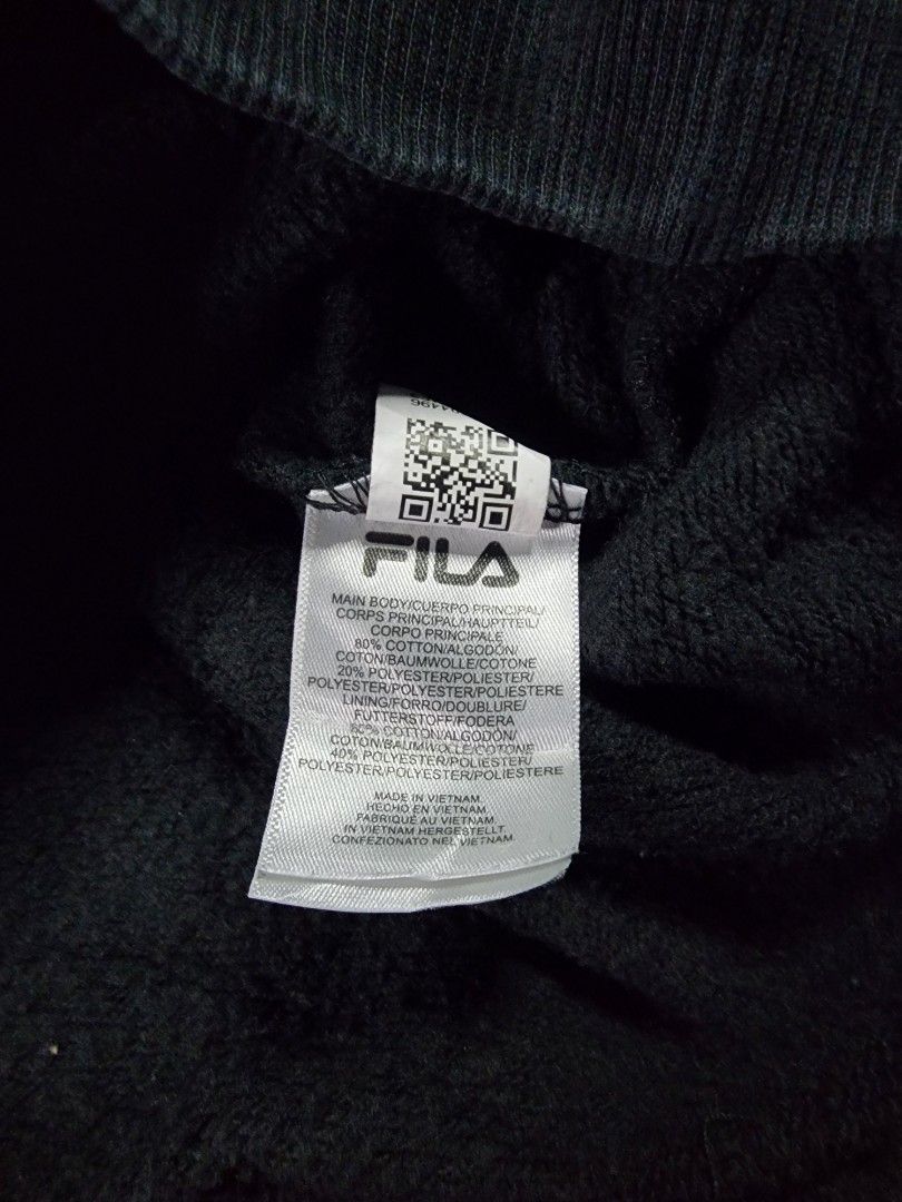 FILA Black Pullover Hoodie (Category: Coats, Jackets and Outerwear) located in La Trinidad. Submitted by closetloop2601 (Listing ID 1446301912, Image 3). Description: 35 0 + SF Size : Large on tag W: 23 in | L: 21.5 in Very good condition Color may vary due to lighting.