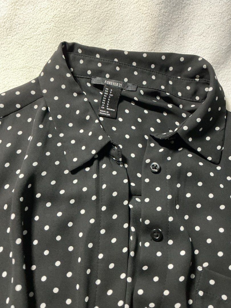 Forever 21 Black White Polka Dot Button Up Shirt (Category: Shirts) located in Pateros City. Submitted by studentista (Listing ID 1446338987, Image 2). Description: - Brand: Forever 21 - Color: Black with white polka dots - Style: Button-up shirt - Sleeves: Long sleeves - Estimated Size: S - Occasion: Casual wear or dressing up.