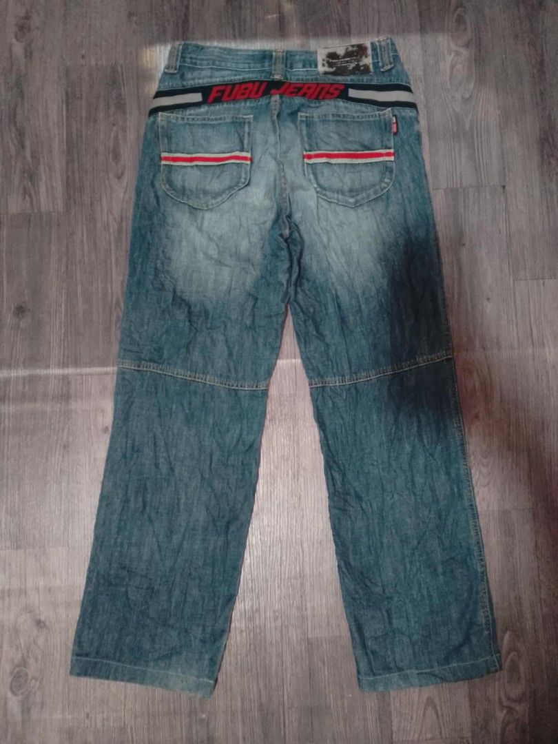 FUBU JEANS Collection Denim Pants (Category: Jeans) located in Manila. Submitted by ererane19 (Listing ID 1446184505, Image 2). Description: - Classic FUBU jeans - Light wash denim - Red and white stripe details on pockets and waistband size 30-32 - FUBU JEANS COLLECTION graphic on back - 100% pure denim - Straight leg fit - Great for casual wear.