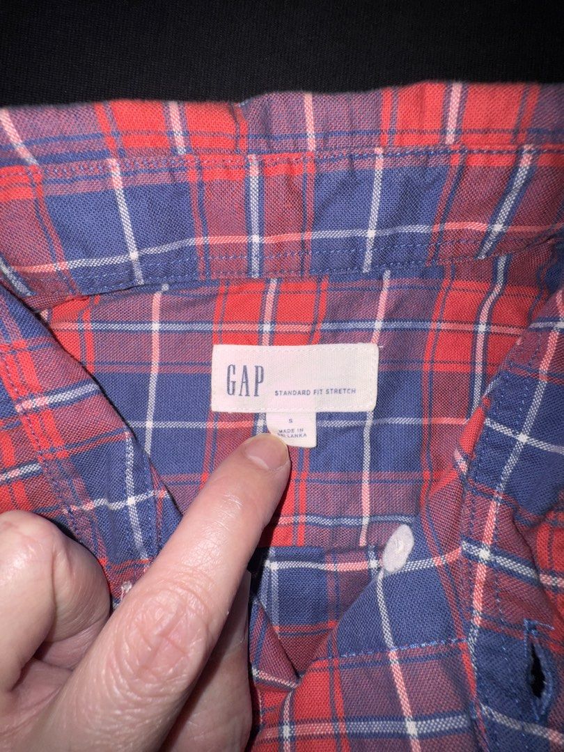 GAP Short Sleeve Plaid Button Down Shirt Size S (Category: Tshirts & Polo Shirts ) located in Taguig. Submitted by crossmill23 (Listing ID 1446330268, Image 2). Description: - Classic red and blue plaid short sleeve shirt from GAP. - Standard fit with stretch for comfort. - Features a button-down front and collar. - Ideal for casual wear. - Easily pairs with jeans or shorts. - RFS: Outgrown.