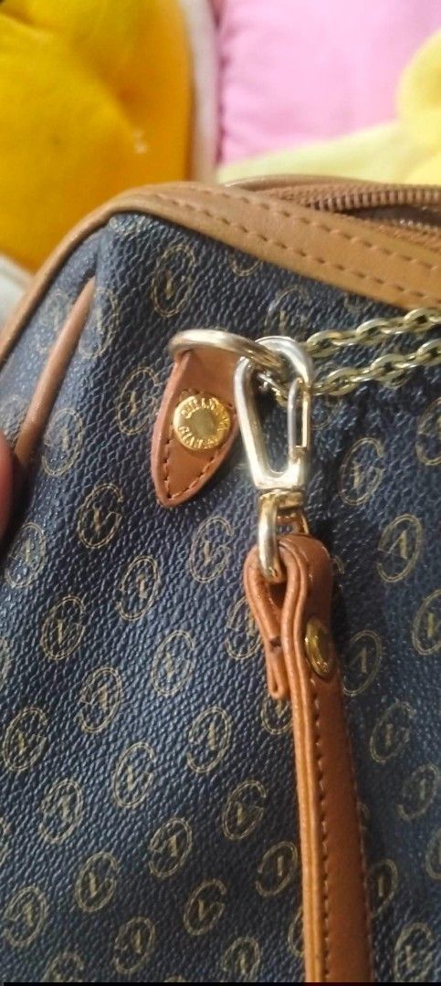 gianni valentino Monogram Shoulder Bag (Category: Luxury Bags & Wallets) located in Urdaneta. Submitted by japanluxurybagsbymcbags (Listing ID 1446342611, Image 2). Description: - Stylish brown and tan monogram shoulder bag - Genuine leather trim and strap - Elegant gold chain detailing - Secure zipper closure - Interior brand tag - Ideal for everyday use.