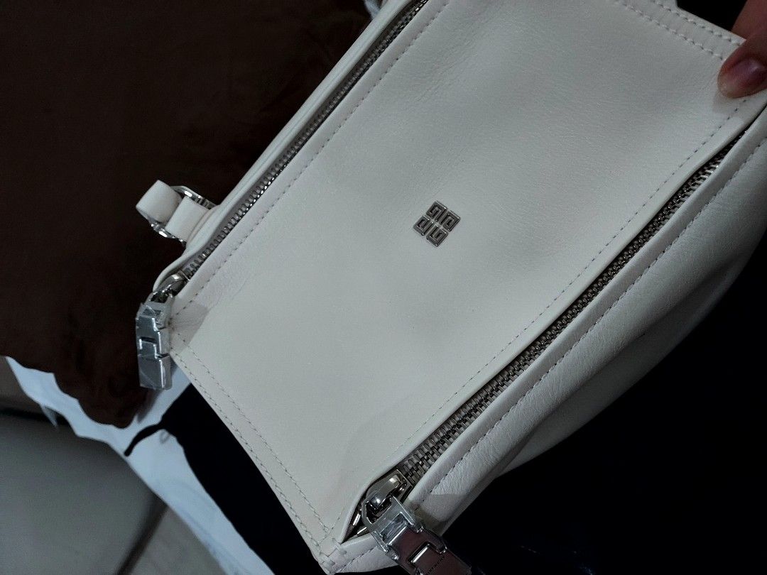 Givenchy Pandora Bnew (Category: Luxury Bags & Wallets) located in Paranaque City. Submitted by andim8 (Listing ID 1446216599, Image 2). Description: - Authentic Givenchy Pandora Small - Color: ivory - Includes original dust bag and tags - Features a top handle - Comes with a detachable shoulder strap - Elegant silver hardware details - Ideal for everyday styling and use.