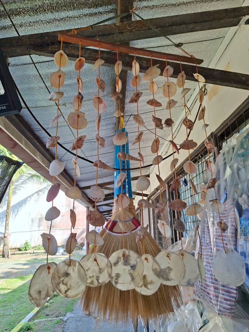 Handmade Shell Wind Chime by Dean (Category: Other Home Decor) located in Caloocan City. Submitted by ednamanlapaz21 (Listing ID 1446315029, Image 1). Description: Beautiful handmade wind chime made with various seashells. Features a wooden bar and orange strings. Perfect for adding a coastal vibe to your home or garden. Each shell is unique. Great for gifting or personal decor. Measures approximately [insert length if known]..