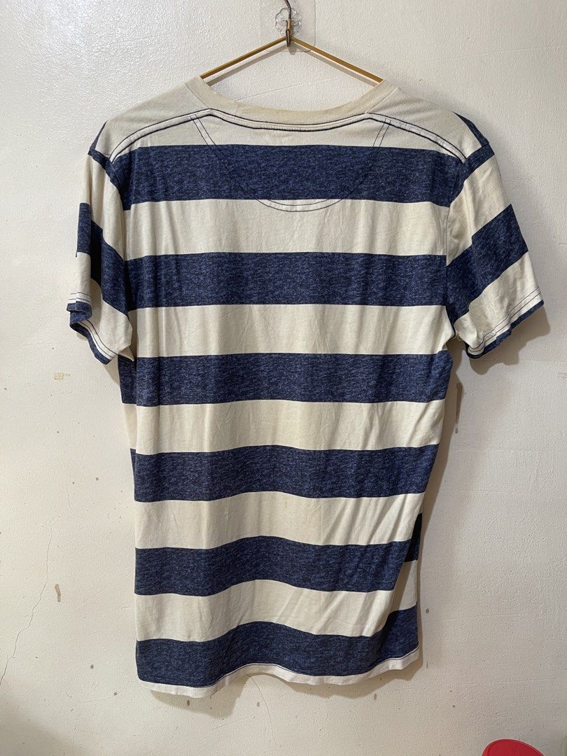Hollister Striped T-shirt medium (Category: Tshirts & Polo Shirts ) located in Cebu City. Submitted by gemmarshall (Listing ID 1446331282, Image 2). Description: - Classic blue and cream stripes - Brand: Hollister - Short sleeves - Crew neck - Textured fabric - Perfect for casual wear - Easy to pair with jeans or shorts - Simple and comfortable.