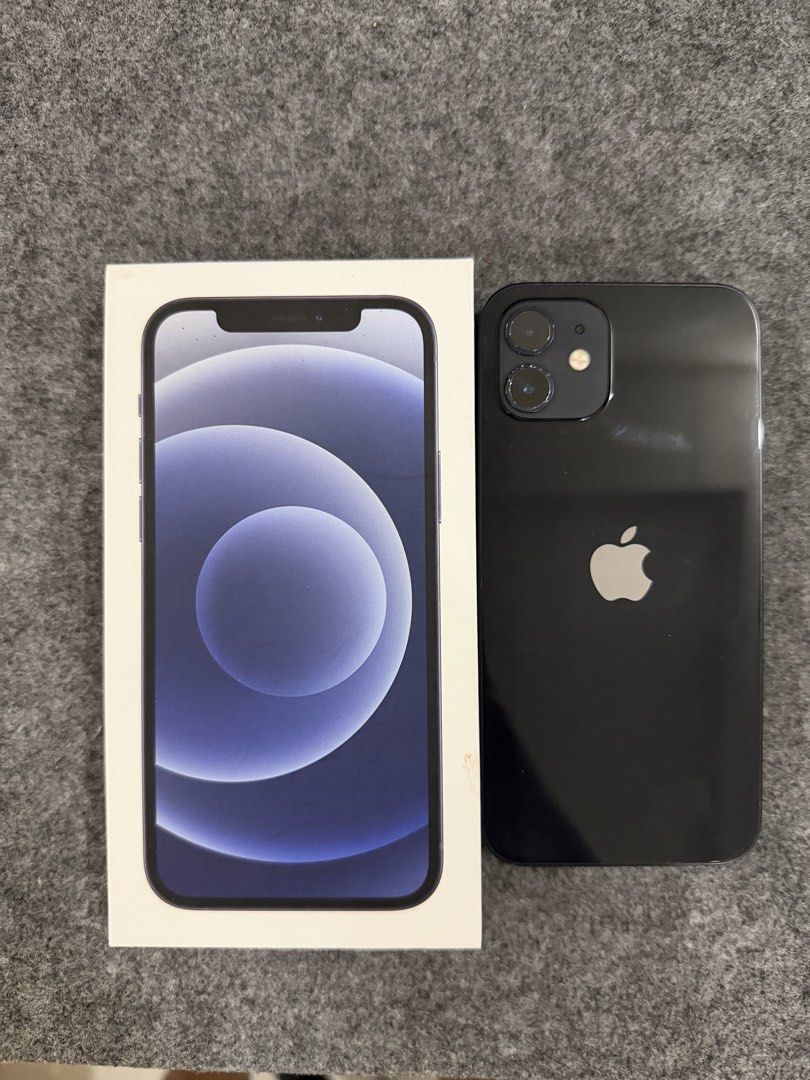 Iphone 12 (Category: iPhone 12 Series) located in Batangas. Submitted by carandangt85672 (Listing ID 1446177807, Image 2). Description: iphone 12 64gb black 77% battery health ✅ True Tone Working ✅ Face ID Working No repair history No SIM restriction Issue: Pain chip sa camera and dents sa gilid Inclusion: Orig Box and Case Only.