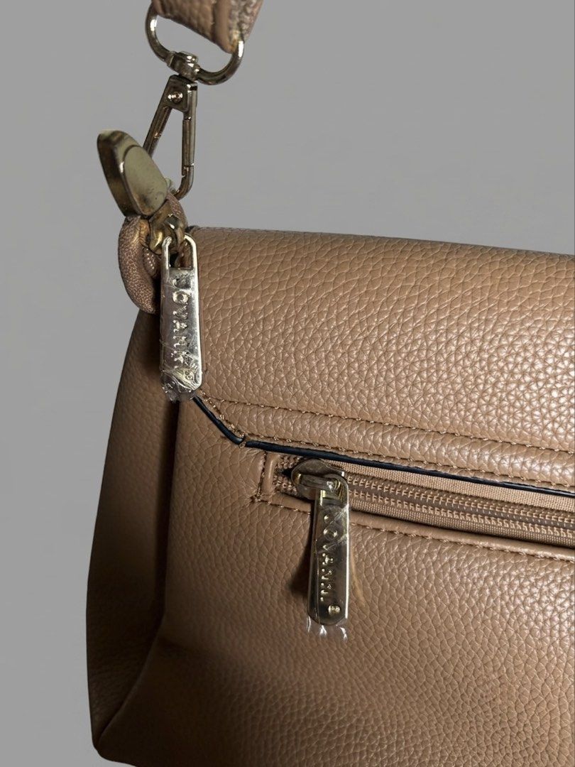 JOVANNI Leather Crossbody Bag (Category: Cross-body Bags) located in Manila. Submitted by izzmya (Listing ID 1446179311, Image 3). Description: - Pebbled leather texture - Adjustable strap - Back zip pocket - Multiple interior compartments - Magnetic flap closure - Gold hardware details - Clean inside and out.
