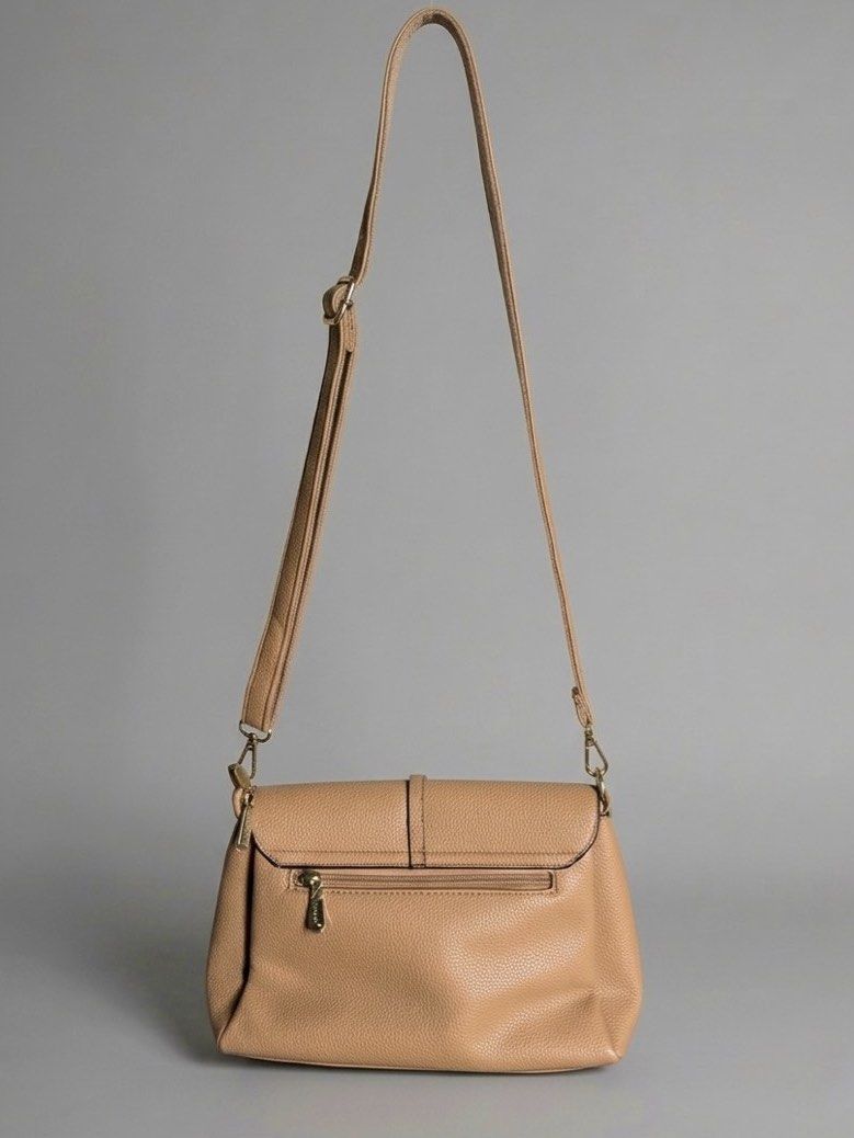 JOVANNI Leather Crossbody Bag (Category: Cross-body Bags) located in Manila. Submitted by izzmya (Listing ID 1446179311, Image 2). Description: - Pebbled leather texture - Adjustable strap - Back zip pocket - Multiple interior compartments - Magnetic flap closure - Gold hardware details - Clean inside and out.
