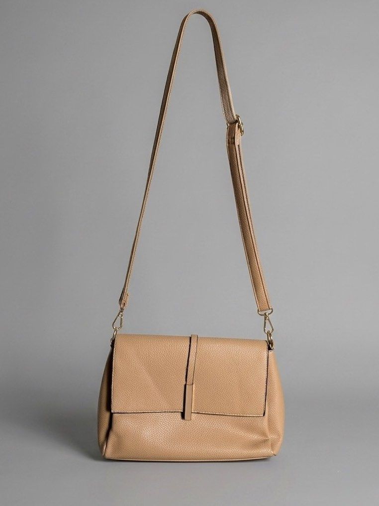 JOVANNI Leather Crossbody Bag (Category: Cross-body Bags) located in Manila. Submitted by izzmya (Listing ID 1446179311, Image 1). Description: - Pebbled leather texture - Adjustable strap - Back zip pocket - Multiple interior compartments - Magnetic flap closure - Gold hardware details - Clean inside and out.