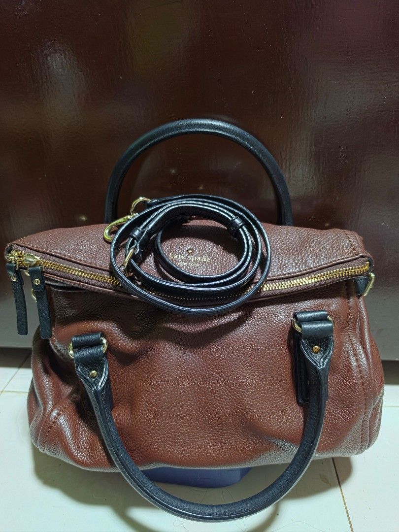 Kate Spade Brown Leather Satchel Bag with Strap (Category: Luxury Bags & Wallets) located in San Mateo. Submitted by bambags (Listing ID 1446291983, Image 2). Description: - Authentic Kate Spade brown leather satchel bag - Versatile: Top handles and detachable shoulder strap - Secure zipper closure - Elegant gold-tone hardware - Spacious interior, ideal for everyday use.