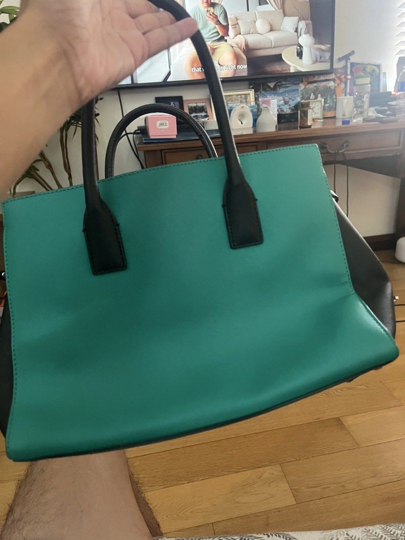 Kate Spade Tote Bag - Teal, White, Black (Category: Tote Bags) located in Cyberjaya. Submitted by ezzfikri1100628 (Listing ID 1446169023, Image 3). Description: - Brand: Kate Spade - Style: Classic Tote Bag - Colors: Teal, White, Black Color Blocking - Features: Top Handles, Striped Interior Lining, Interior Zippered Compartments - Functionality: Spacious, ideal for daily essentials - Versatility: A stylish accessory for any outfit.