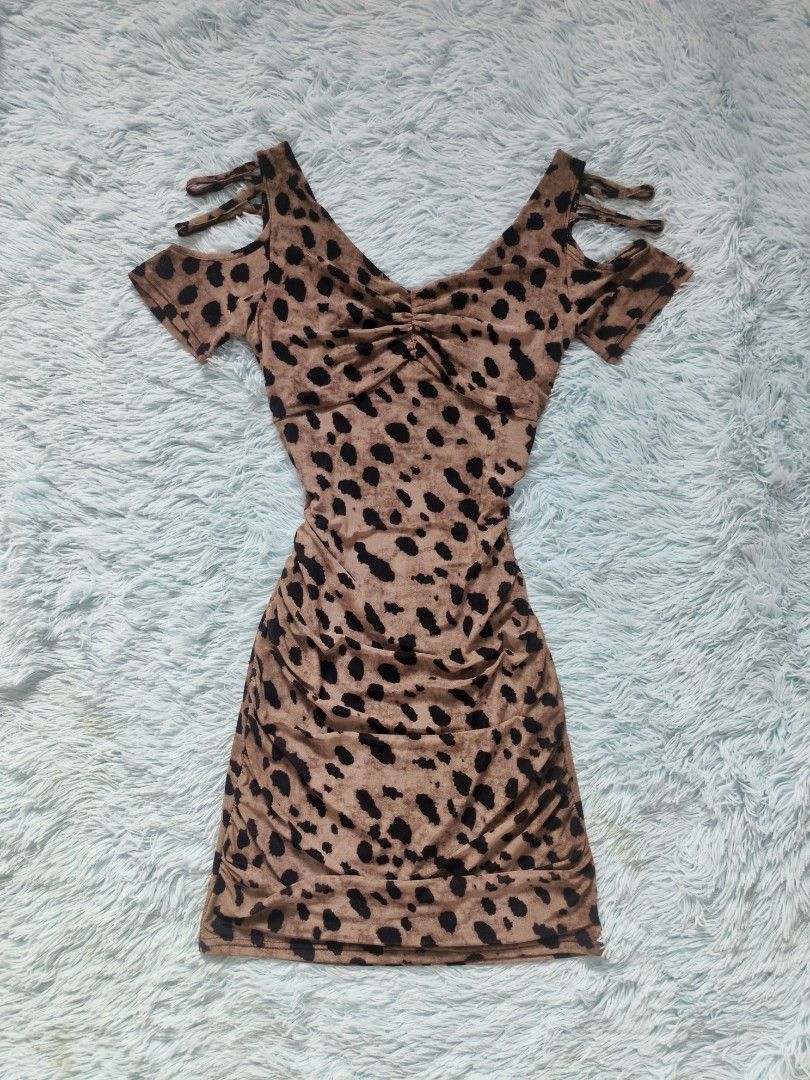 Leopard Print Cold Shoulder Ruched Bodycon Mini Dress (Category: Dresses) located in Quezon City. Submitted by alluring.avenue (Listing ID 1446272034, Image 1). Description: Cute leopard print mini dress. Features a ruched front detail and cold shoulder cut-outs with tie straps. Stretchy material. Great for a night out or a party. Fits snugly..