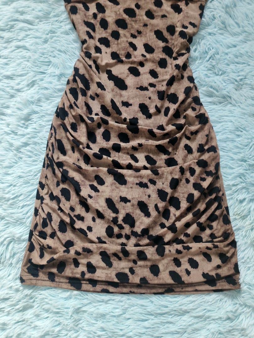Leopard Print Cold Shoulder Ruched Bodycon Mini Dress (Category: Dresses) located in Quezon City. Submitted by alluring.avenue (Listing ID 1446272034, Image 3). Description: Cute leopard print mini dress. Features a ruched front detail and cold shoulder cut-outs with tie straps. Stretchy material. Great for a night out or a party. Fits snugly..
