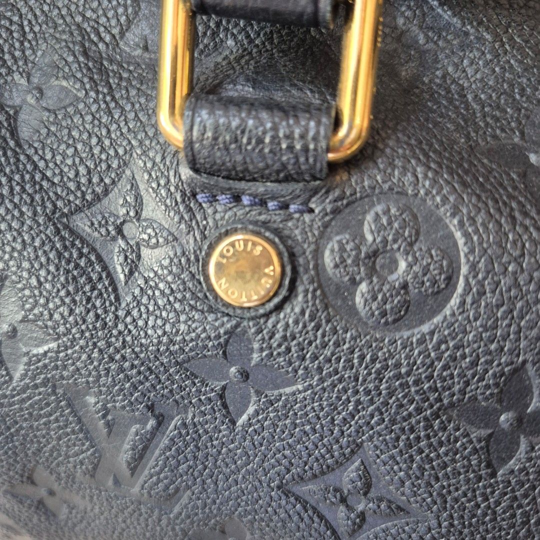 Louis Vuitton Empreinte Speedy Bag (Category: Luxury Bags & Wallets) located in Antipolo. Submitted by eastshoppinghaven (Listing ID 1446196887, Image 3). Description: - Authentic Louis Vuitton Speedy Bag - Material: Monogram Empreinte Leather - Includes: Detachable shoulder strap, extendable strap included but not able to show on the photos Soft style leather so in style today.