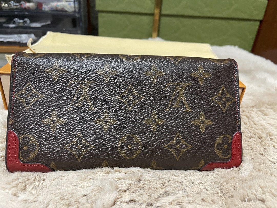 Louis Vuitton Monogram Envelope Wallet with Red Trim (Category: Luxury Bags & Wallets) located in Cavite. Submitted by beamitch (Listing ID 1446194596, Image 2). Description: - Authentic Louis Vuitton wallet - Classic monogram canvas with red leather trim - Envelope style with snap closure - Red interior - Includes original Louis Vuitton box and dust bag - Perfect for organizing essentials mode of shipping: lbc only or any rider to be book by the
