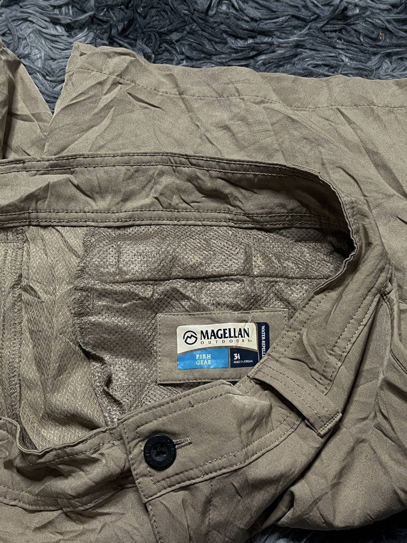 Magellan Outdoors Fish Gear Cargo Shorts Size 34 (Category: Shorts) located in Bulacan. Submitted by sef19 (Listing ID 1446342919, Image 2). Description: - Brand: Magellan Outdoors - Color: Khaki - Style: Cargo Shorts - Designed for: Fishing and outdoor activities - Features: Multiple pockets, including a zippered cargo pocket on the left leg - Closure: Button and zip fly - Fit: Comfortable for outdoor wear - Ideal for: Fishing trips, casual wear