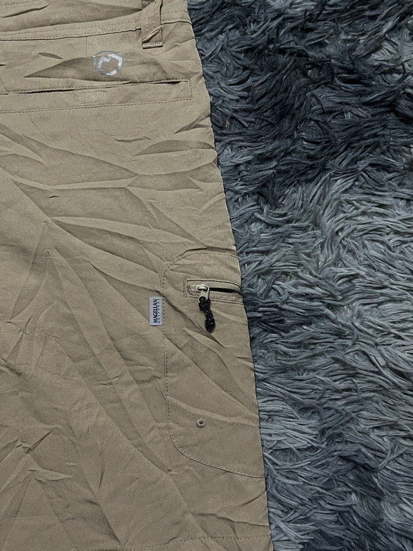 Magellan Outdoors Fish Gear Cargo Shorts Size 34 (Category: Shorts) located in Bulacan. Submitted by sef19 (Listing ID 1446342919, Image 3). Description: - Brand: Magellan Outdoors - Color: Khaki - Style: Cargo Shorts - Designed for: Fishing and outdoor activities - Features: Multiple pockets, including a zippered cargo pocket on the left leg - Closure: Button and zip fly - Fit: Comfortable for outdoor wear - Ideal for: Fishing trips, casual wear