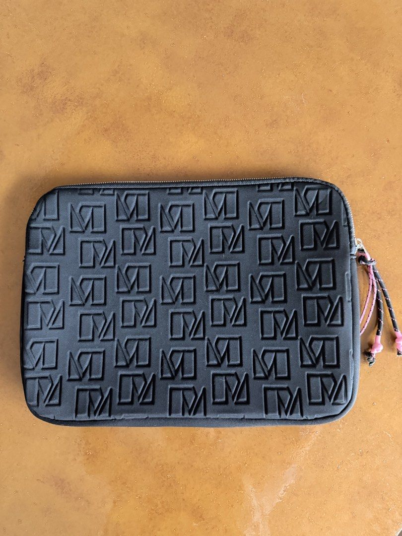 Mango Laptop bag (Category: Laptop Bags & Sleeves) located in Manila. Submitted by khloejesy (Listing ID 1446184231, Image 1). Description: - Black pouch with repeating monogram pattern - Zipper closure - Small pink and black cord pull - Ideal for organizing small items - Authentic Mango item.