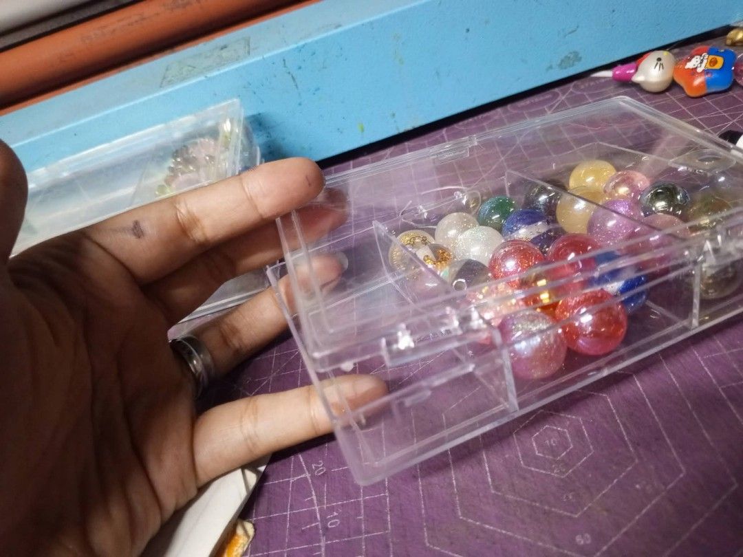 Mixed Resin Beads with Organizer (Category: Craft Supplies & Tools) located in Bulacan. Submitted by yanna2106 (Listing ID 1446333395, Image 2). Description: - Assorted colors and designs included - Comes with a clear organizer box - Organizer has 24 compartments - Ideal for various crafting projects.