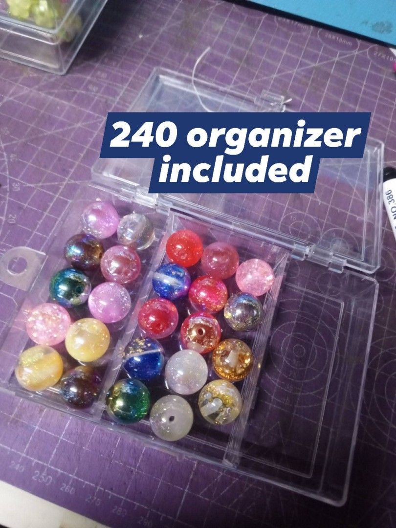 Mixed Resin Beads with Organizer (Category: Craft Supplies & Tools) located in Bulacan. Submitted by yanna2106 (Listing ID 1446333395, Image 1). Description: - Assorted colors and designs included - Comes with a clear organizer box - Organizer has 24 compartments - Ideal for various crafting projects.