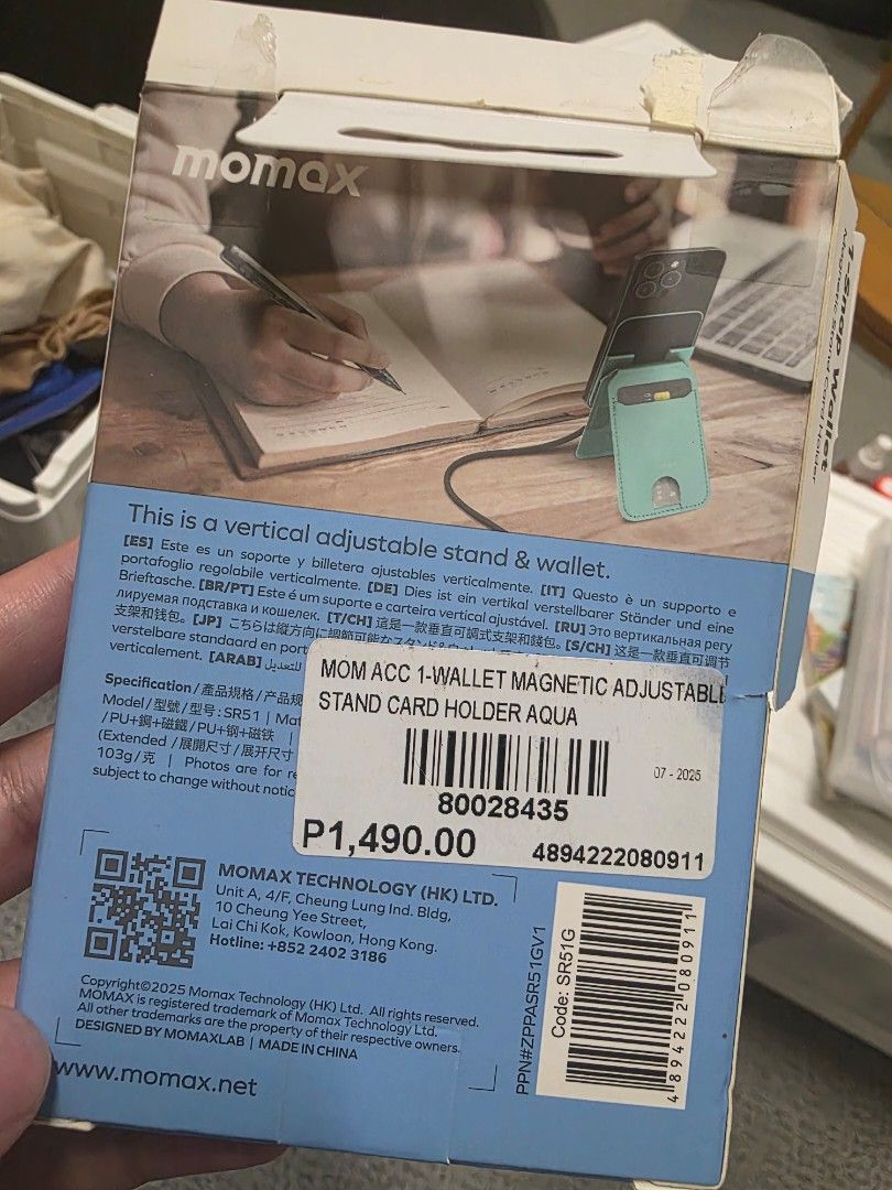 Momax Aqua Magnetic Adjustable Stand & Wallet (Category: Mounts & Holders) located in Quezon City. Submitted by kenscapade (Listing ID 1446232940, Image 1). Description: - Momax Magnetic Stand & Wallet - Color: Aqua - Features an adjustable vertical stand for hands-free viewing Broke the box but product still sealed. .