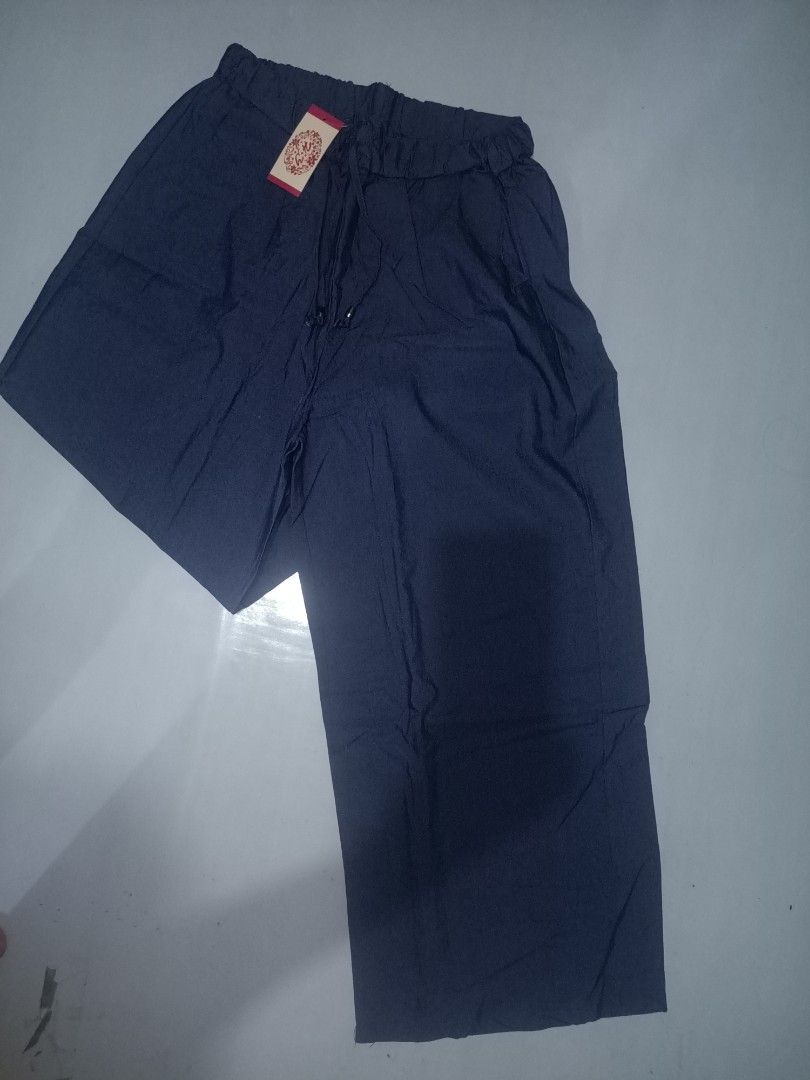 Navy Blue Elastic Waist Pants with Drawstring (Category: Other Bottoms) located in Las Pinas. Submitted by ZHOEYCLOTHING (Listing ID 1446304931, Image 1). Description: - Comfy navy blue pants - Elastic waistband with adjustable drawstring - Relaxed fit - Ideal for lounging or casual wear - Brand new with tags still attached.