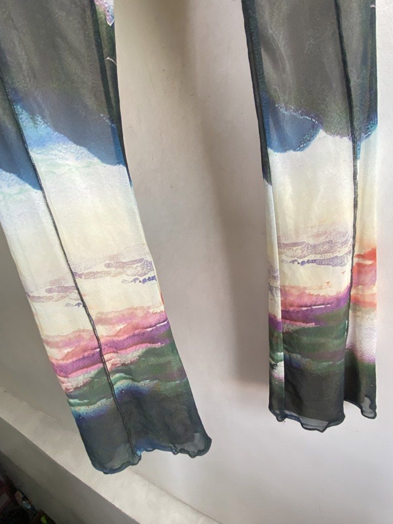 Neon&nylon flared pants (Category: Other Bottoms) located in San Juan City. Submitted by helpabaddietodecclutter (Listing ID 1446286033, Image 3). Description: - Brand: Neon & Nylon - Style: Flared Pants - Size: XXS - Design: Unique artistic/landscape print - Material: Sheer, lightweight fabric - Fit: Flared leg.