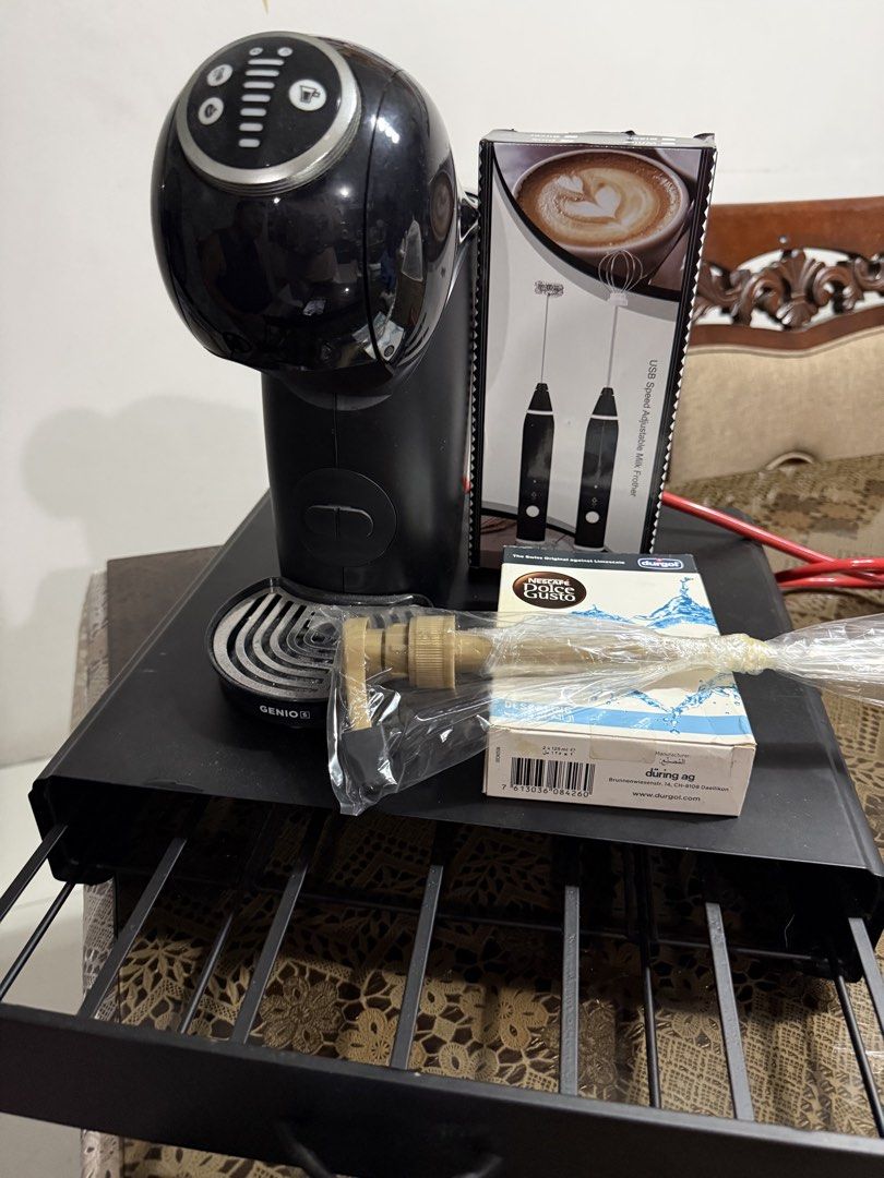 Nescafé Dolce Gusto Genio 2 Coffee Machine + Accessories (Category: Coffee Machines & Makers) located in Paranaque City. Submitted by bratty.20 (Listing ID 1446313484, Image 1). Description: - Black Nescafé Dolce Gusto Genio 2 coffee machine - Includes milk frother - Comes with Durgol descaling solution - Perfect for making various coffee drinks at home - All items shown in the photos are included.