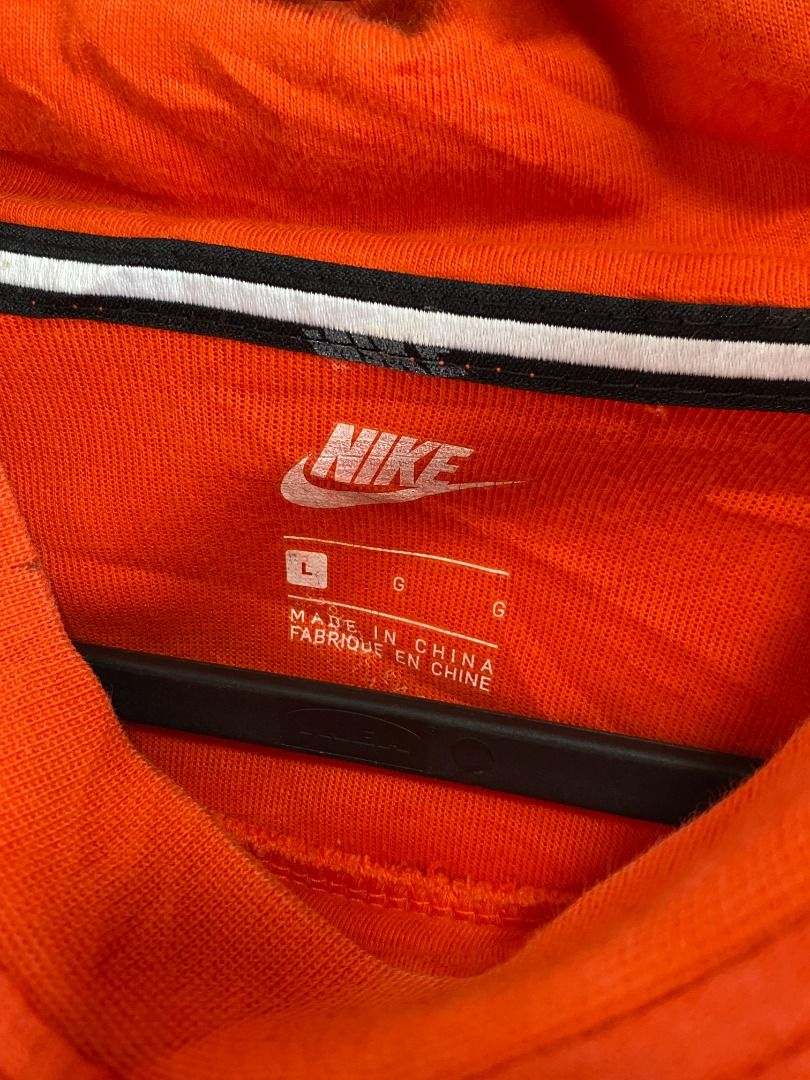 Nike Funnel neck Orange Hoodie (Category: Coats, Jackets and Outerwear) located in Tagaytay City. Submitted by grayl_thrift (Listing ID 1446306836, Image 3). Description: - Orange Nike Hoodie - Size: Large (L) - Material: Made in China - Design: Small black Nike logo on the chest.