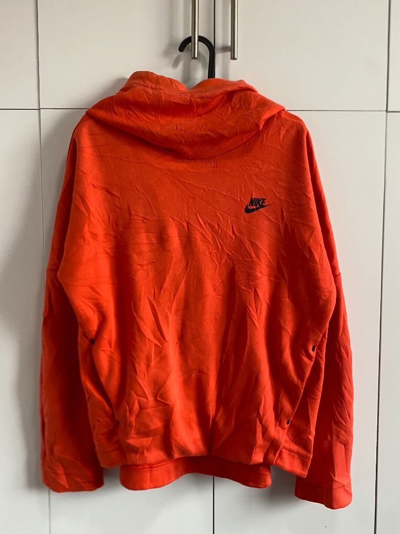 Nike Funnel neck Orange Hoodie (Category: Coats, Jackets and Outerwear) located in Tagaytay City. Submitted by grayl_thrift (Listing ID 1446306836, Image 1). Description: - Orange Nike Hoodie - Size: Large (L) - Material: Made in China - Design: Small black Nike logo on the chest.