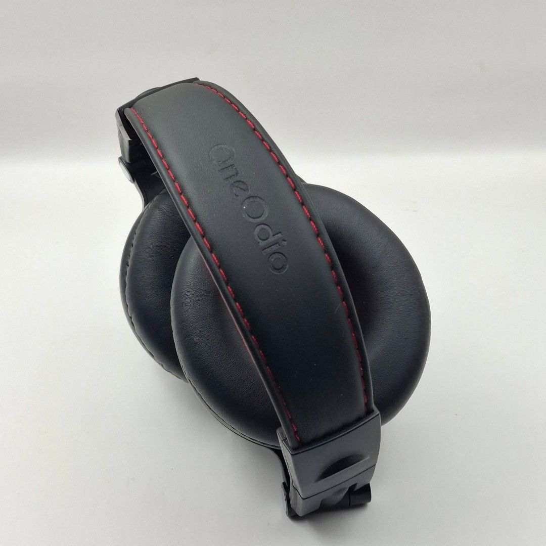 OneOdio Over-Ear Headphones with Detachable Cable (Category: Headphones & Headsets) located in Baguio. Submitted by thrifty_cool (Listing ID 1446299072, Image 2). Description: - Brand: OneOdio - Type: Over-ear headphones - Color: Black with red inner earcups and headband accent - Features: Swiveling earcups for adjustable comfort - Includes: White audio cable with 3.5mm connectors - Ideal for: Music listening, DJing.