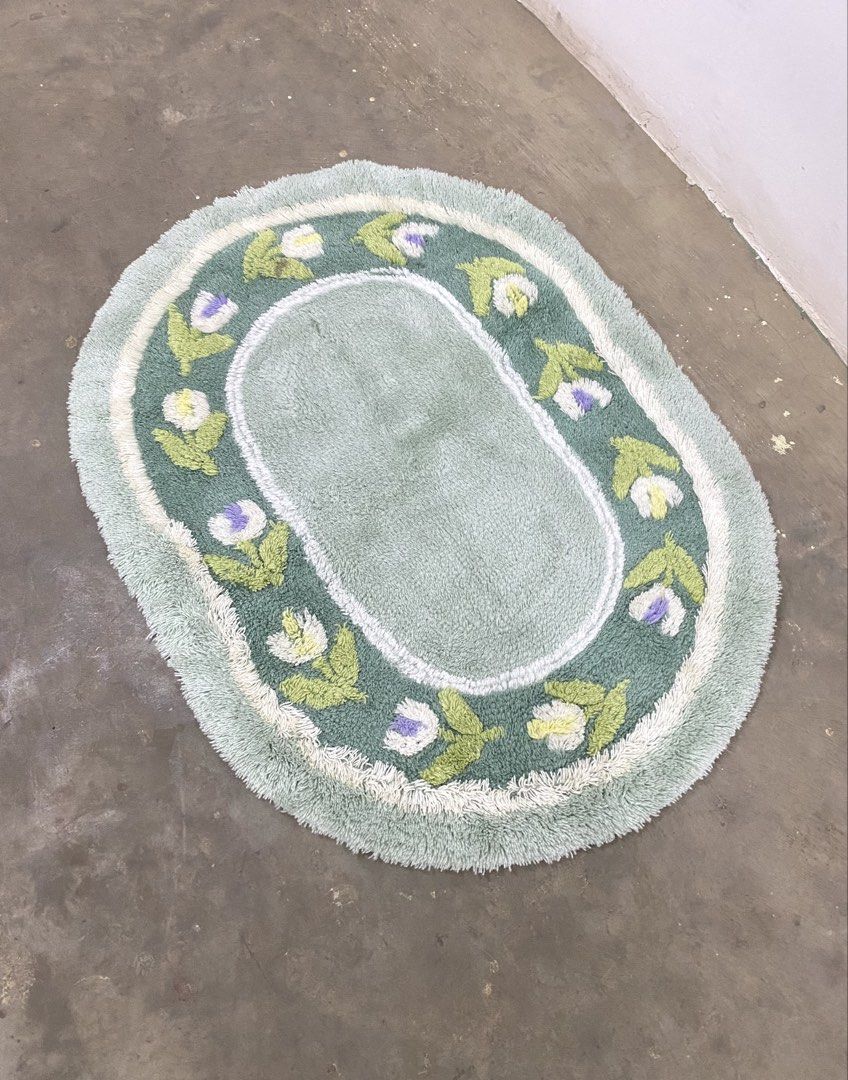 Oval Tufted Bath Mat with Floral Border (Category: Carpets, Mats & Flooring) located in Santa Rosa. Submitted by annie_annie83 (Listing ID 1446217129, Image 2). Description: - Cute oval bath mat - Light green color - Embroidered flowers (white, purple, green leaves) - Fuzzy texture - Adds a nice touch to your bathroom.
