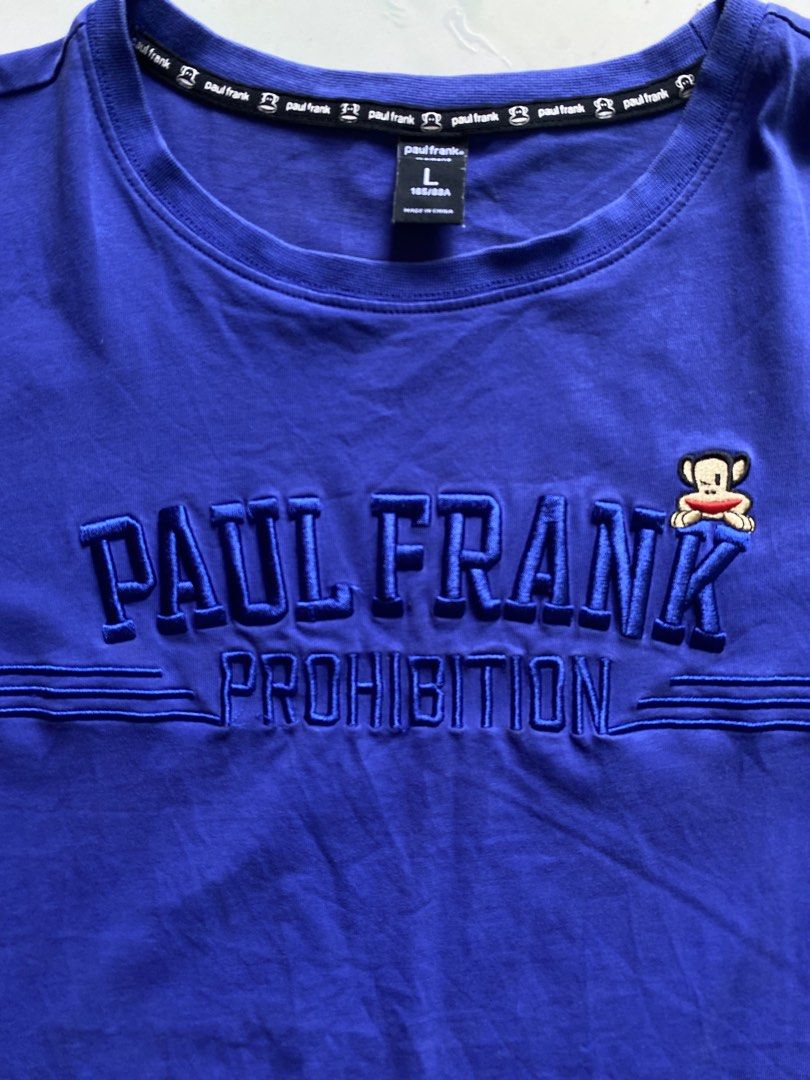 Paul Frank Julius Monkey Embroidered Graphic Tee Blue (Category: Tshirts & Polo Shirts ) located in Nagcarlan. Submitted by puredriponly (Listing ID 1446200855, Image 3). Description: 💙 ✔️ Original Paul Frank design ✔️ Embroidered “PAUL FRANK PROHIBITION” logo sa harap ✔️ May iconic Julius monkey patch detail ✔️ Soft at komportableng tela ✔️ Perfect para sa casual at streetwear outfit ✔️ Color: Blue ✔️ Size: L (check actual measurements para sur