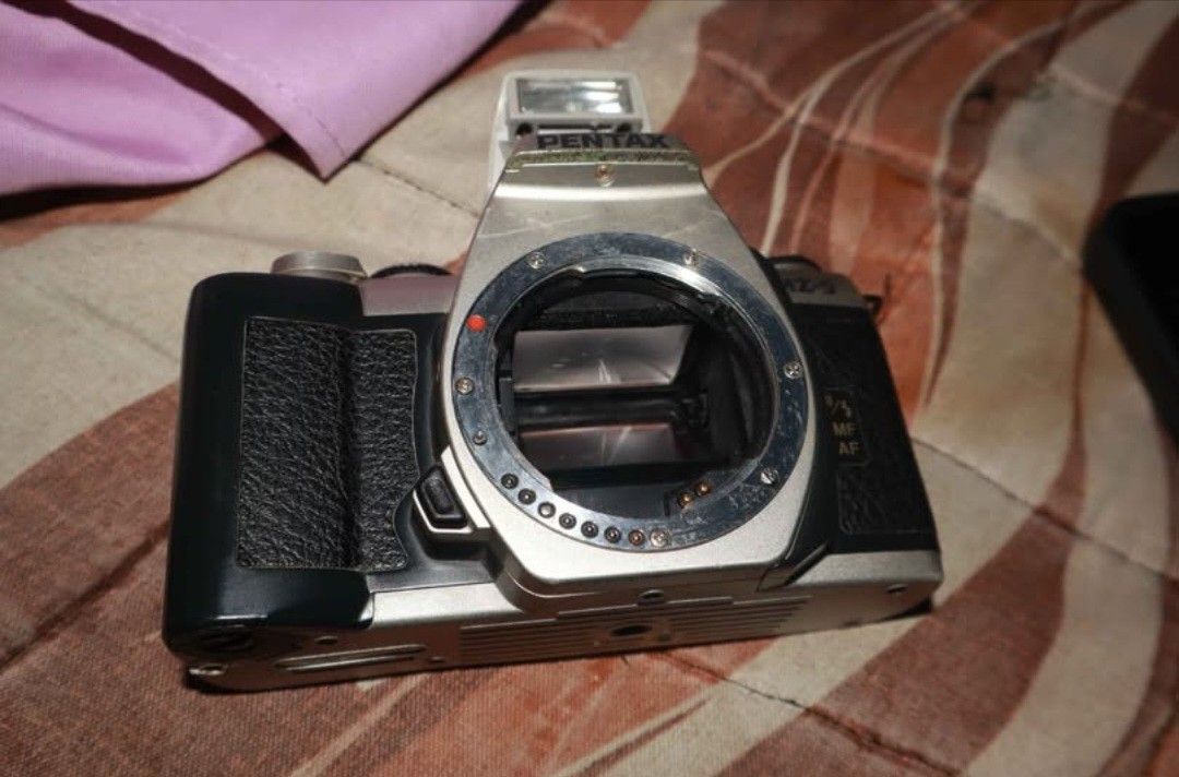 Pentax MZ-5 (Category: Cameras) located in Laoag. Submitted by itemsbycob (Listing ID 1446174030, Image 2). Description: Pentax MZ-5 body only. Shutter fires and rewind works, the camera is film tested doesn't have the broken pinion issue Selling for cheap price of 1000 pesos lens (Pentax Smc 70-210mm autofocus) sold separately for 950 pesos (Has fog but autofocus works) Buyer shoulders the shipping fee can give discount if buy the lens and this 