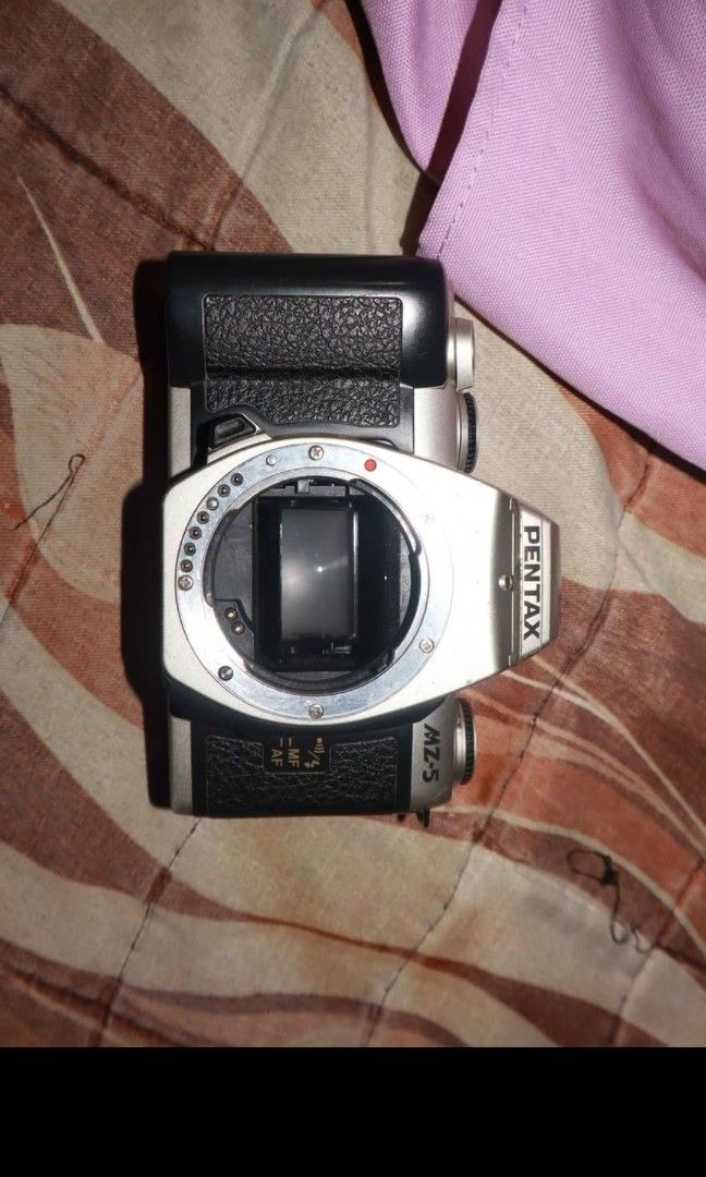 Pentax MZ-5 (Category: Cameras) located in Laoag. Submitted by itemsbycob (Listing ID 1446174030, Image 1). Description: Pentax MZ-5 body only. Shutter fires and rewind works, the camera is film tested doesn't have the broken pinion issue Selling for cheap price of 1000 pesos lens (Pentax Smc 70-210mm autofocus) sold separately for 950 pesos (Has fog but autofocus works) Buyer shoulders the shipping fee can give discount if buy the lens and this 