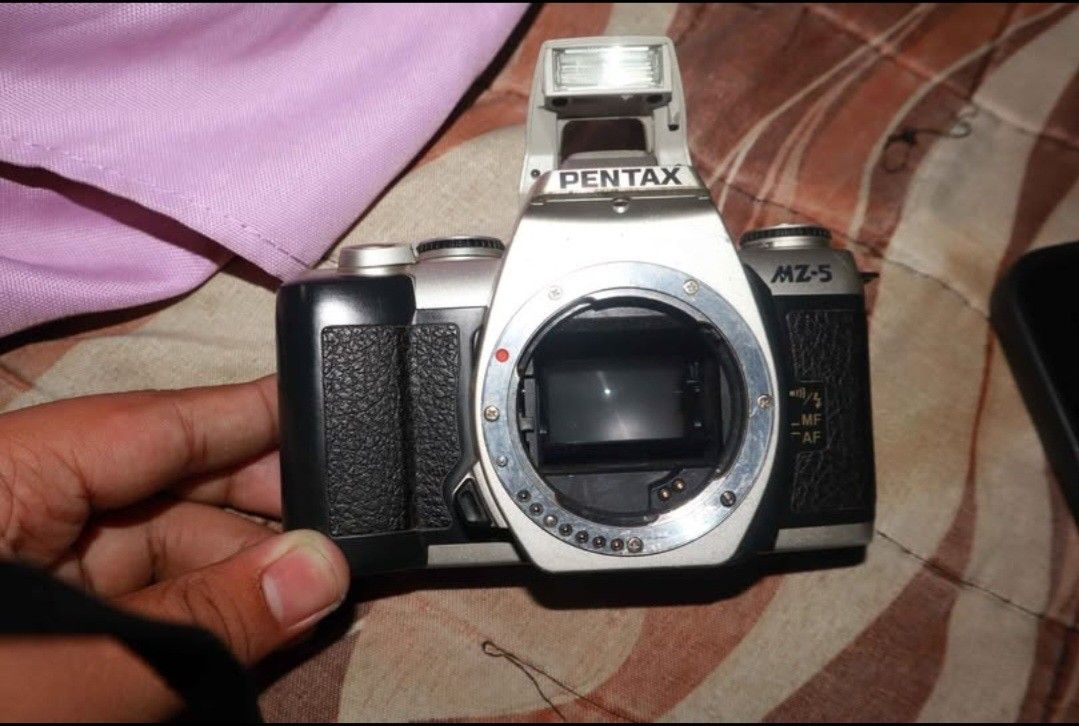Pentax MZ-5 (Category: Cameras) located in Laoag. Submitted by itemsbycob (Listing ID 1446174030, Image 3). Description: Pentax MZ-5 body only. Shutter fires and rewind works, the camera is film tested doesn't have the broken pinion issue Selling for cheap price of 1000 pesos lens (Pentax Smc 70-210mm autofocus) sold separately for 950 pesos (Has fog but autofocus works) Buyer shoulders the shipping fee can give discount if buy the lens and this 