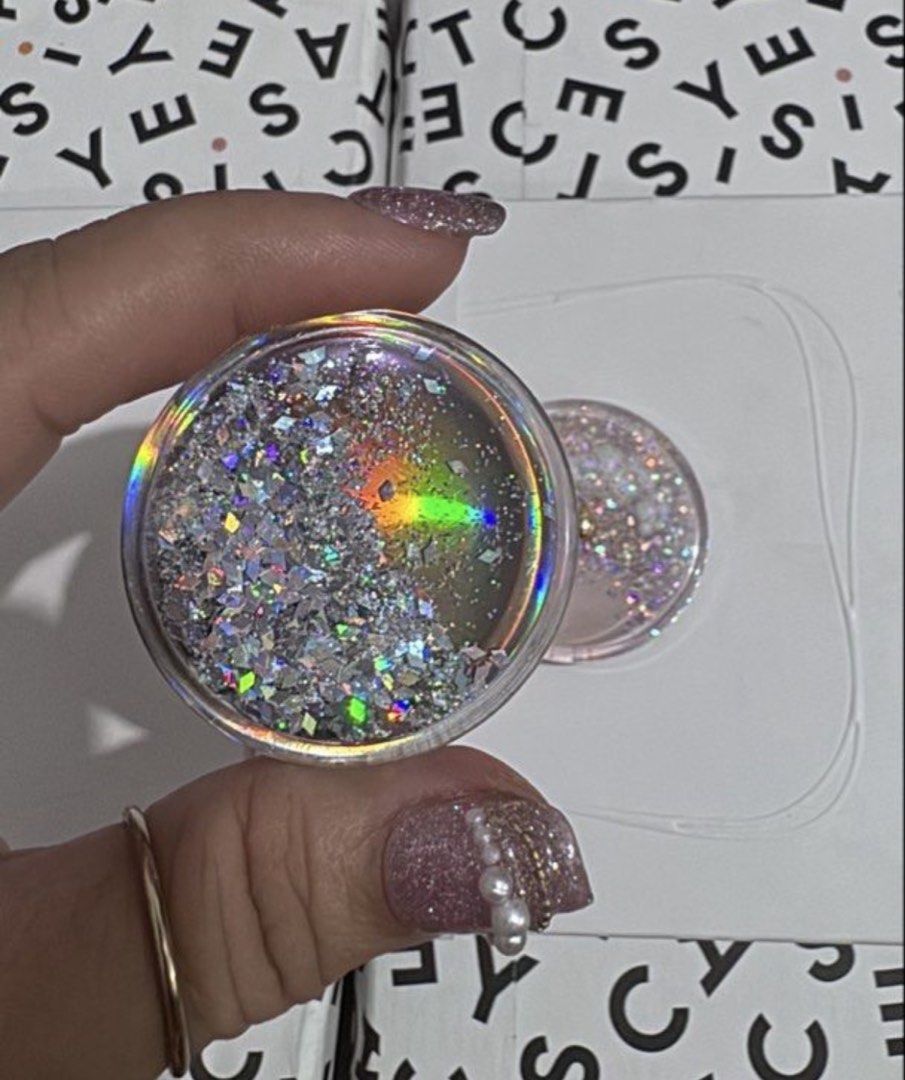 Popsocket (Category: Other Mobile & Gadget Accessories) located in Manila. Submitted by taekook03 (Listing ID 1446342116, Image 3). Description: Selling as set - Pink flower phone grip with yellow center - Clear glittery phone grip with sun and cloud charm - Adds personality and style to your phone - Provides a secure grip for your device - Both are super cute and functional!.