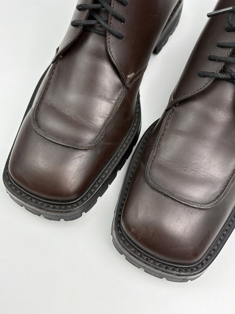 Prada Square Toe Leather Derby Boots (Category: Boots) located in Cavite. Submitted by sc_rcity (Listing ID 1446285816, Image 2). Description: Tagged Size : 9 Men’s | 27cm Insole Authentic Like New Color : Burgundy Minimal sign of wear , Scratches No major flaw Made in Italy No Inclusion Features an apron-toe stitch detail on a smooth leather upper.Built with a chunky, rugged lug outsole for a contemporary look..